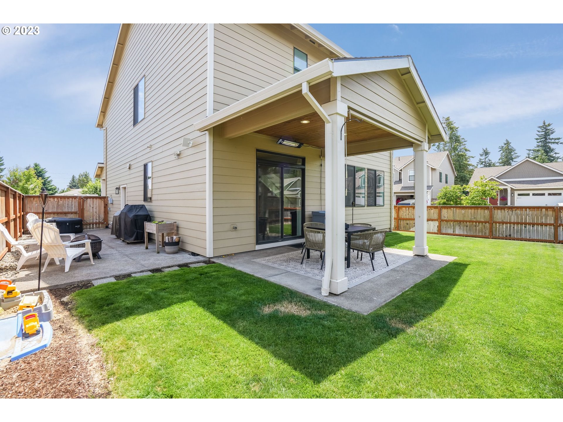 2889 4th Street Hubbard, OR 97032 - Photo 32 of 37 a view of a house with backyard and a patio