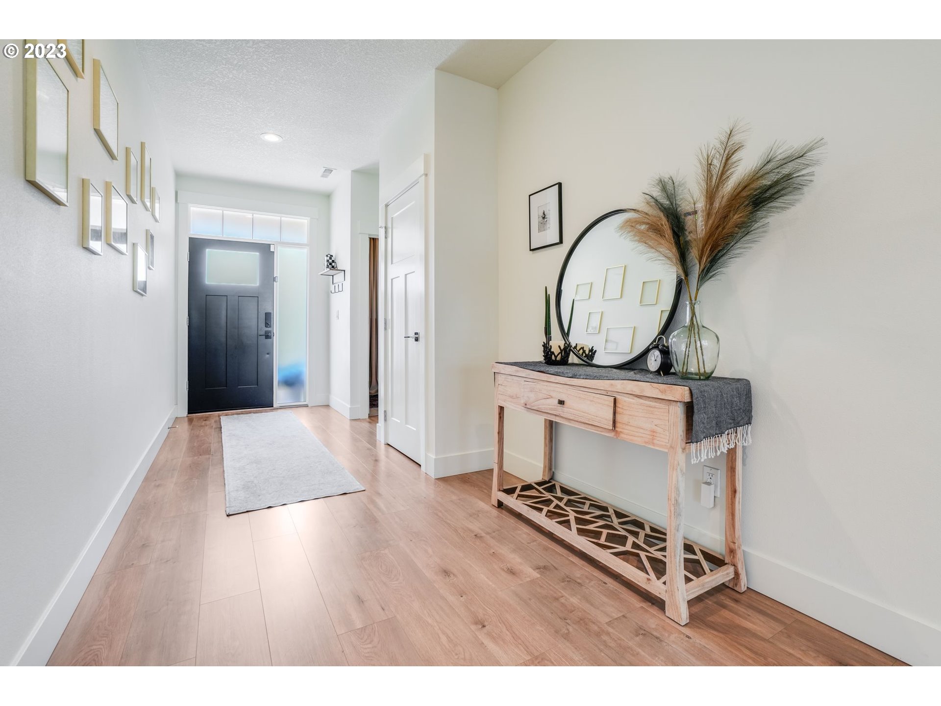 2889 4th Street Hubbard, OR 97032 - Photo 4 of 37 a view of an entryway with wooden floor