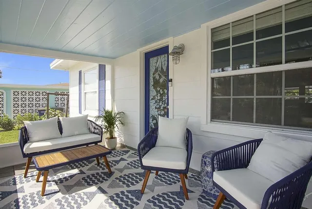 a living room with furniture and a window