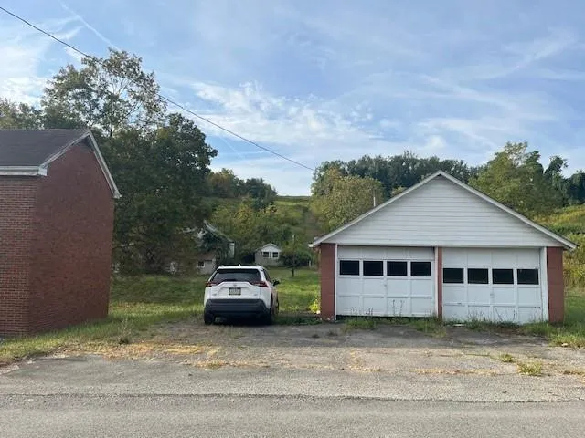 a house with trees in the background