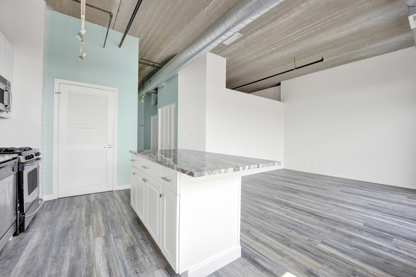 833 West 15th Place, Unit 511 Chicago, IL 60608 - Photo 11 of 21 a view of a hallway with wooden floor and staircase