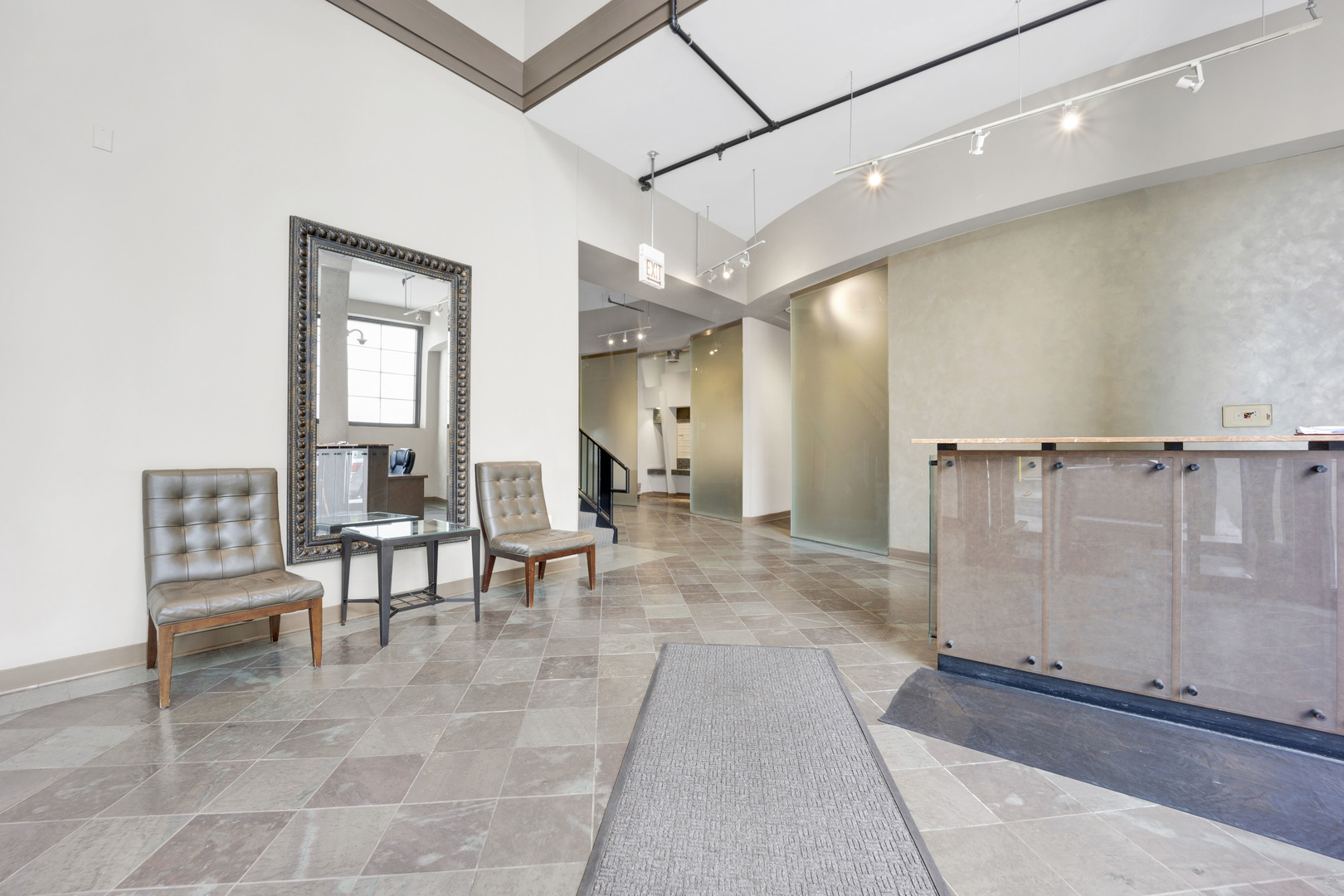833 West 15th Place, Unit 511 Chicago, IL 60608 - Photo 2 of 21 a view of a hallway with furniture and a potted plant