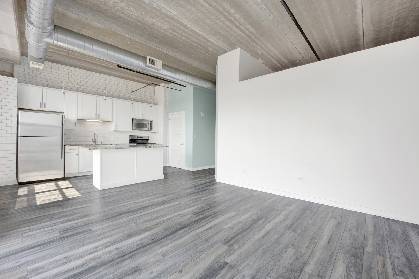 833 West 15th Place, Unit 511 Chicago, IL 60608 - Photo 8 of 21 a view of a kitchen with wooden floor