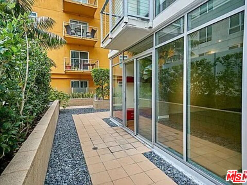 645 West 9th Street, Unit 240 Los Angeles, CA 90015 - Photo 14 of 25 a view of a house with a porch