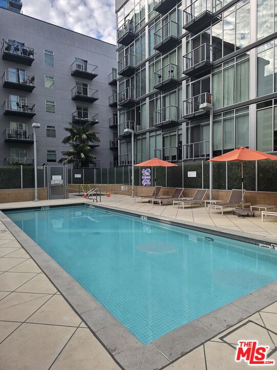 645 West 9th Street, Unit 240 Los Angeles, CA 90015 - Photo 19 of 25 a swimming pool view with a outdoor seating space
