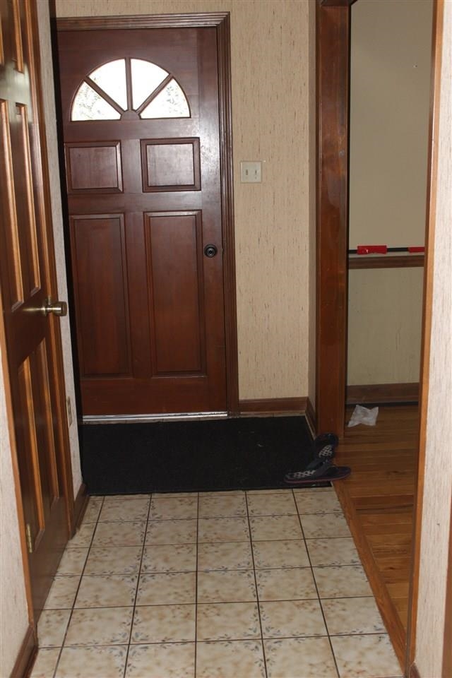 3970 Fun Valley Drive Memphis, TN 38125 - Photo 2 of 12 Entrance foyer with light tile patterned flooring and wallpapered walls