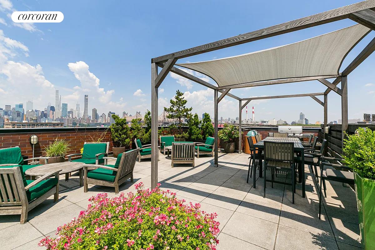 21-45 44th Drive, Unit 6B Queens, NY 11101 - Photo 9 of 14 a view of a patio with a table and chairs