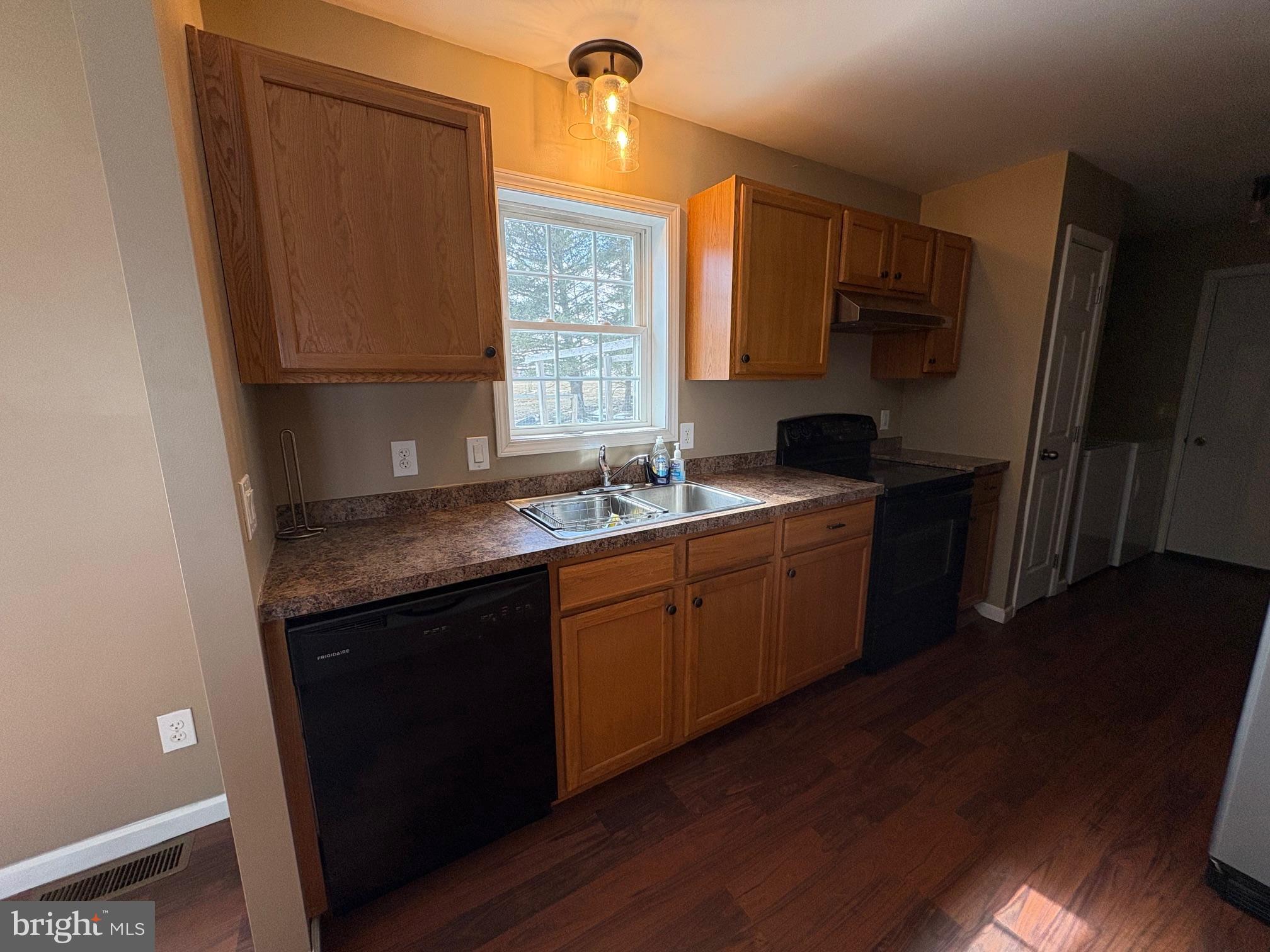514 Kidney Road Genesee, PA 16923 - Photo 13 of 84 a kitchen with granite countertop a sink cabinets and wooden floor