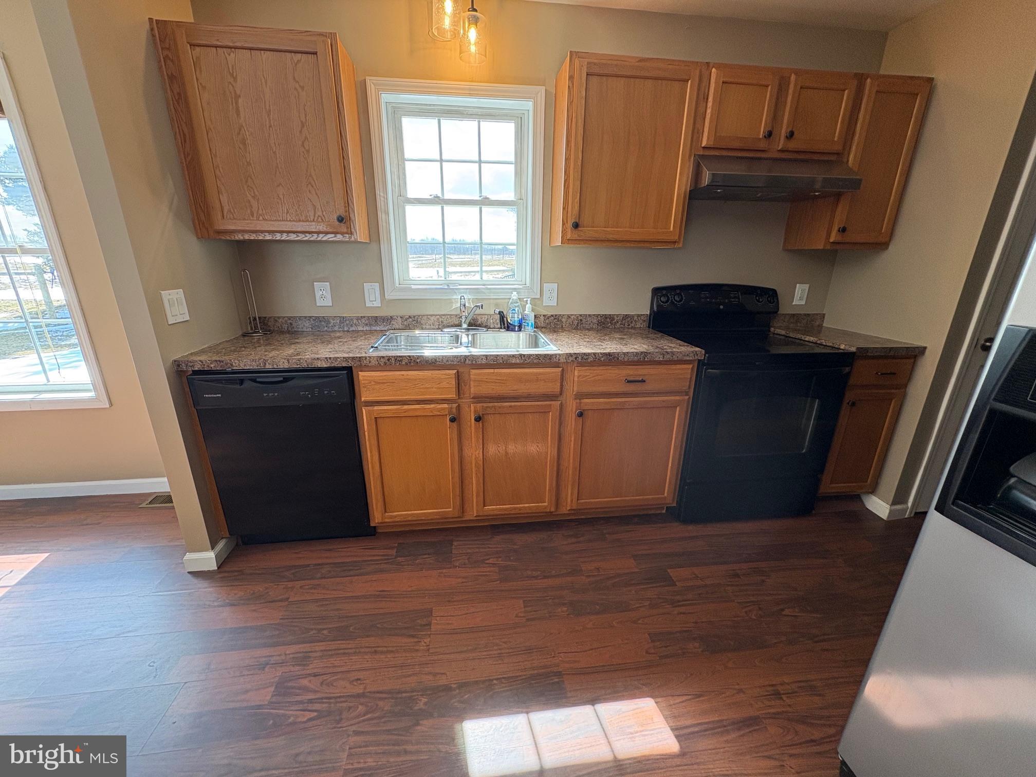 514 Kidney Road Genesee, PA 16923 - Photo 16 of 84 a kitchen with stainless steel appliances granite countertop a sink a stove a refrigerator and cabinets