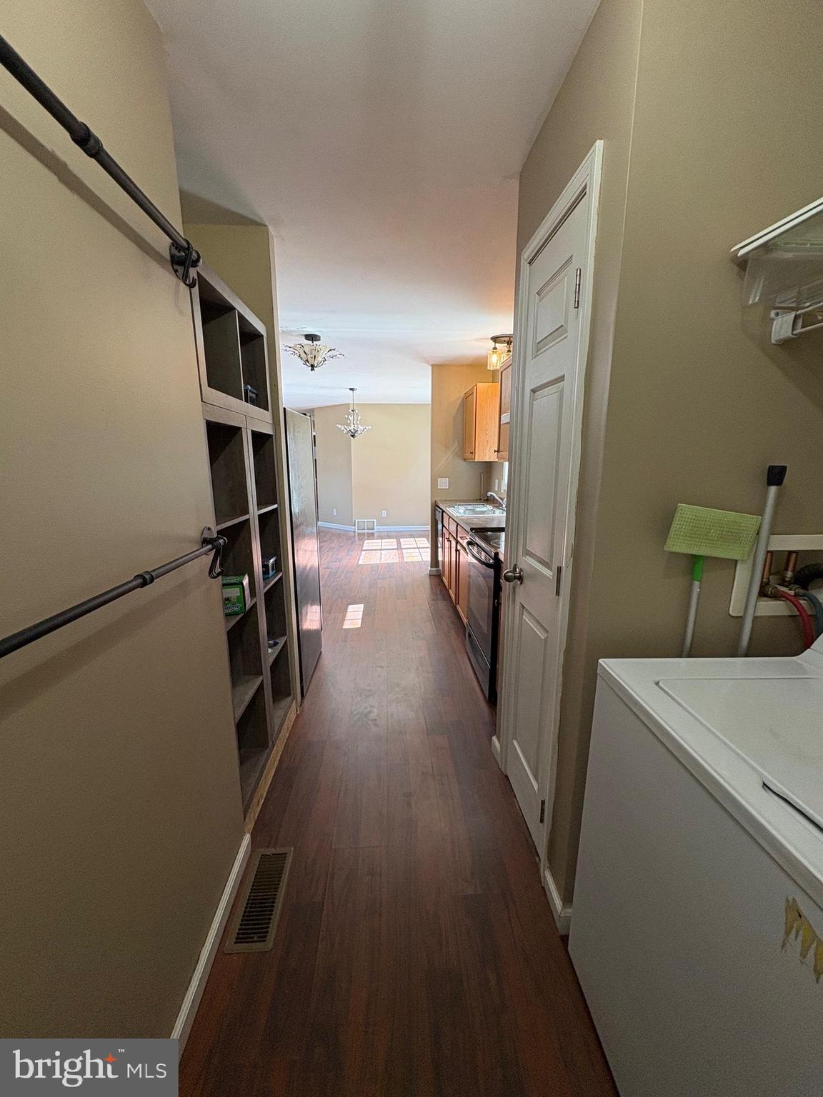 514 Kidney Road Genesee, PA 16923 - Photo 19 of 84 a view of storage and utility room with racks on the wall