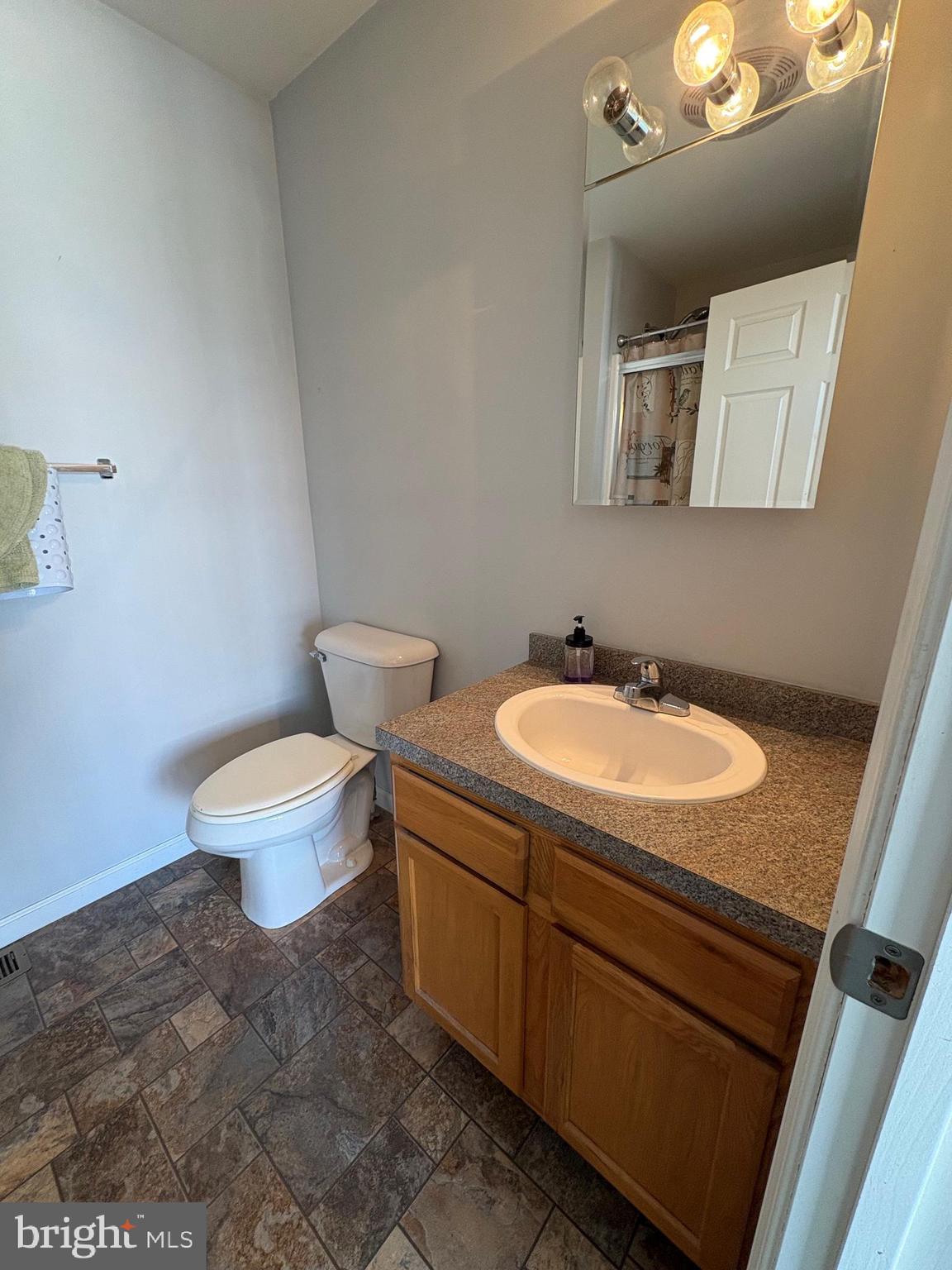514 Kidney Road Genesee, PA 16923 - Photo 35 of 84 a bathroom with a granite countertop sink and a mirror