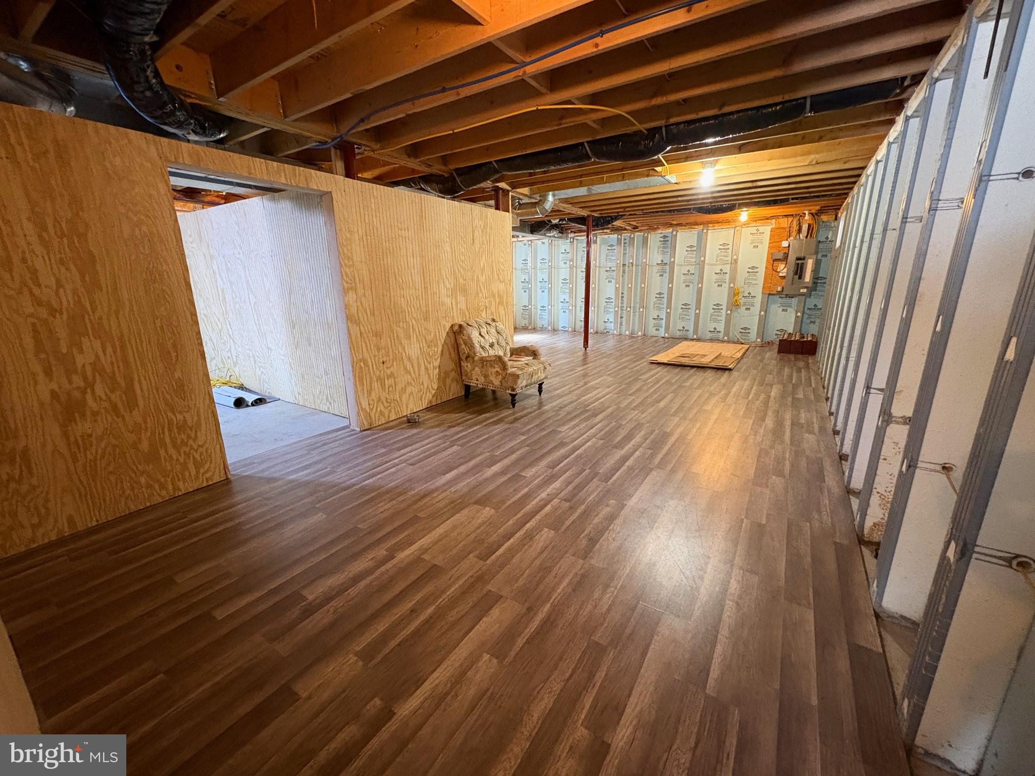 514 Kidney Road Genesee, PA 16923 - Photo 37 of 84 a view of an empty room with wooden floor and a window