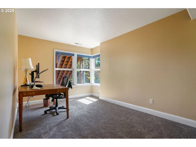 a view of a workspace with furniture