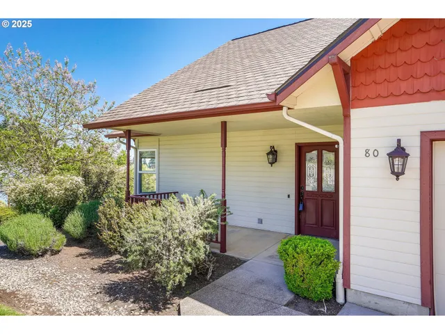 a front view of a house with garden