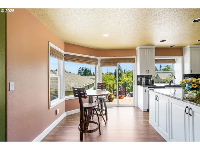a open kitchen with a table and chairs