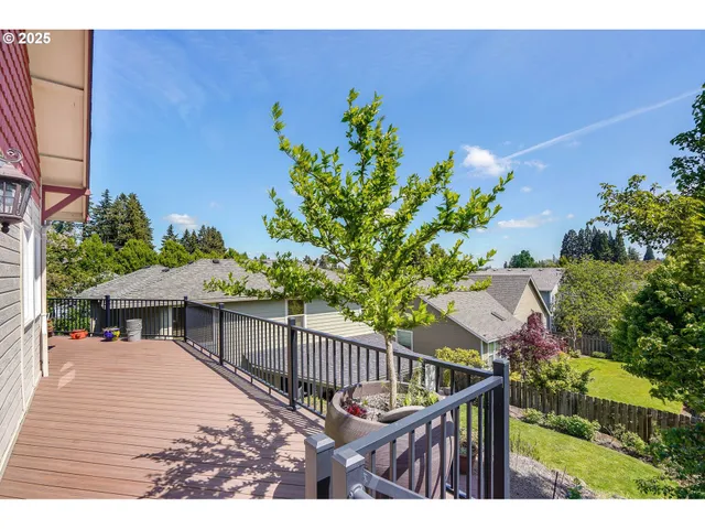 a view of a house with wooden fence