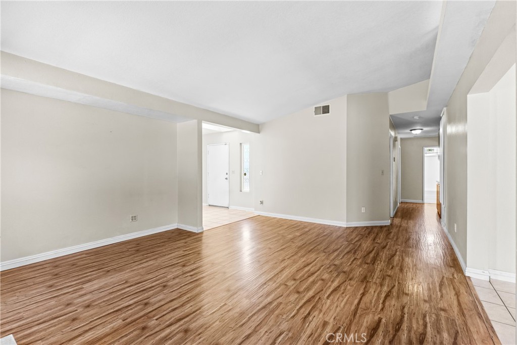 12011 Quantico Drive Riverside, CA 92505 - Photo 11 of 75 a view of an empty room with wooden floor