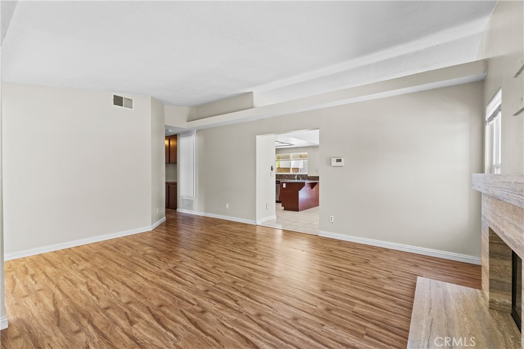 12011 Quantico Drive Riverside, CA 92505 - Photo 12 of 75 a view of empty room with wooden floor