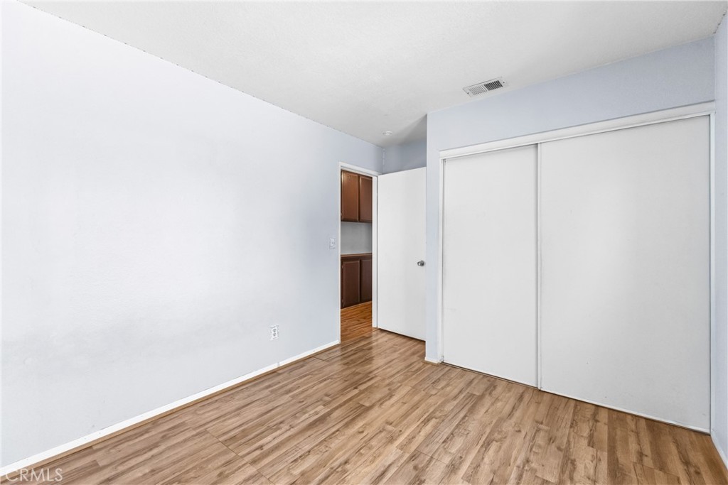 12011 Quantico Drive Riverside, CA 92505 - Photo 30 of 75 a view of an empty room with wooden floor