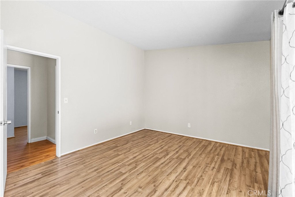 12011 Quantico Drive Riverside, CA 92505 - Photo 35 of 75 a view of empty room with wooden floor