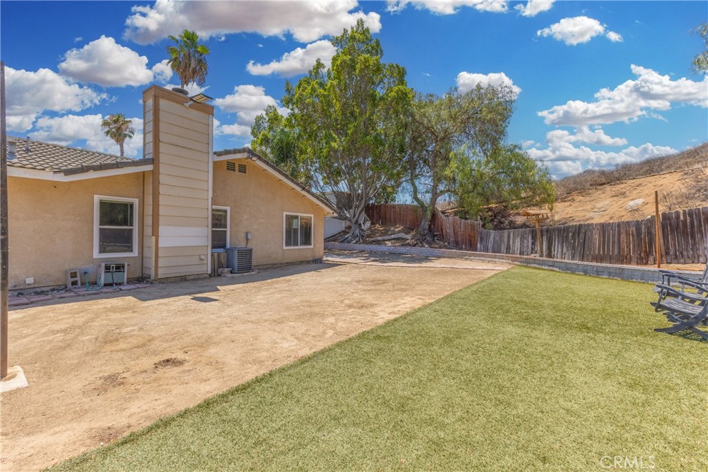 12011 Quantico Drive Riverside, CA 92505 - Photo 46 of 75 a backyard of a house with table and chairs