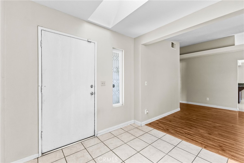 12011 Quantico Drive Riverside, CA 92505 - Photo 6 of 75 a view of a room with wooden floor