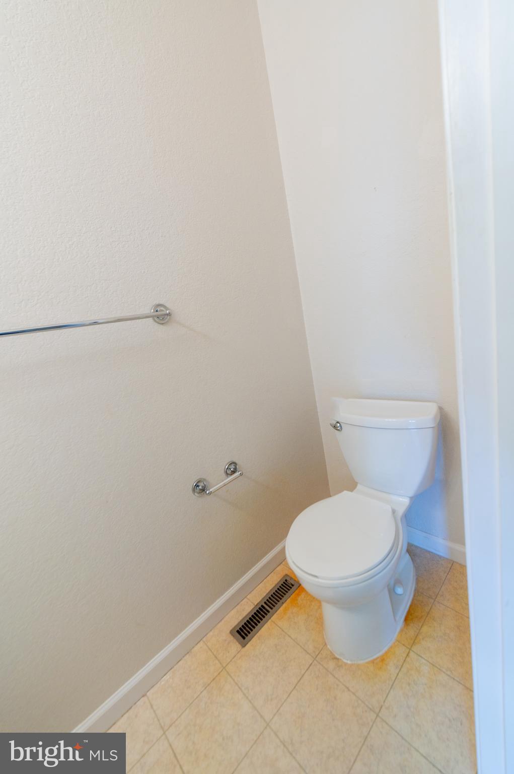 62 Hingham Lane Berlin, MD 21811 - Photo 15 of 44 a white toilet sitting next to a white wall