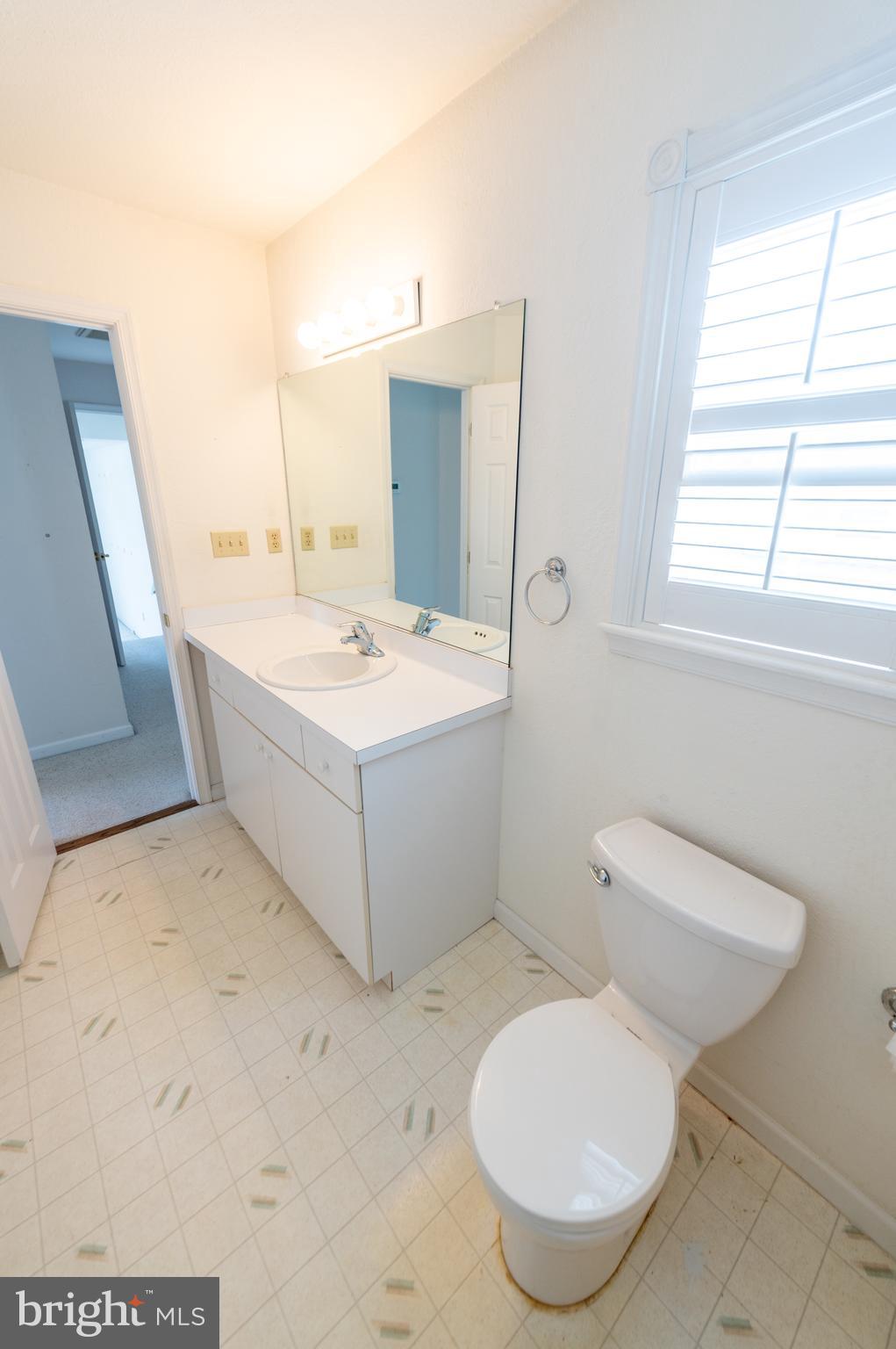 62 Hingham Lane Berlin, MD 21811 - Photo 29 of 44 a bathroom with a sink toilet and mirror