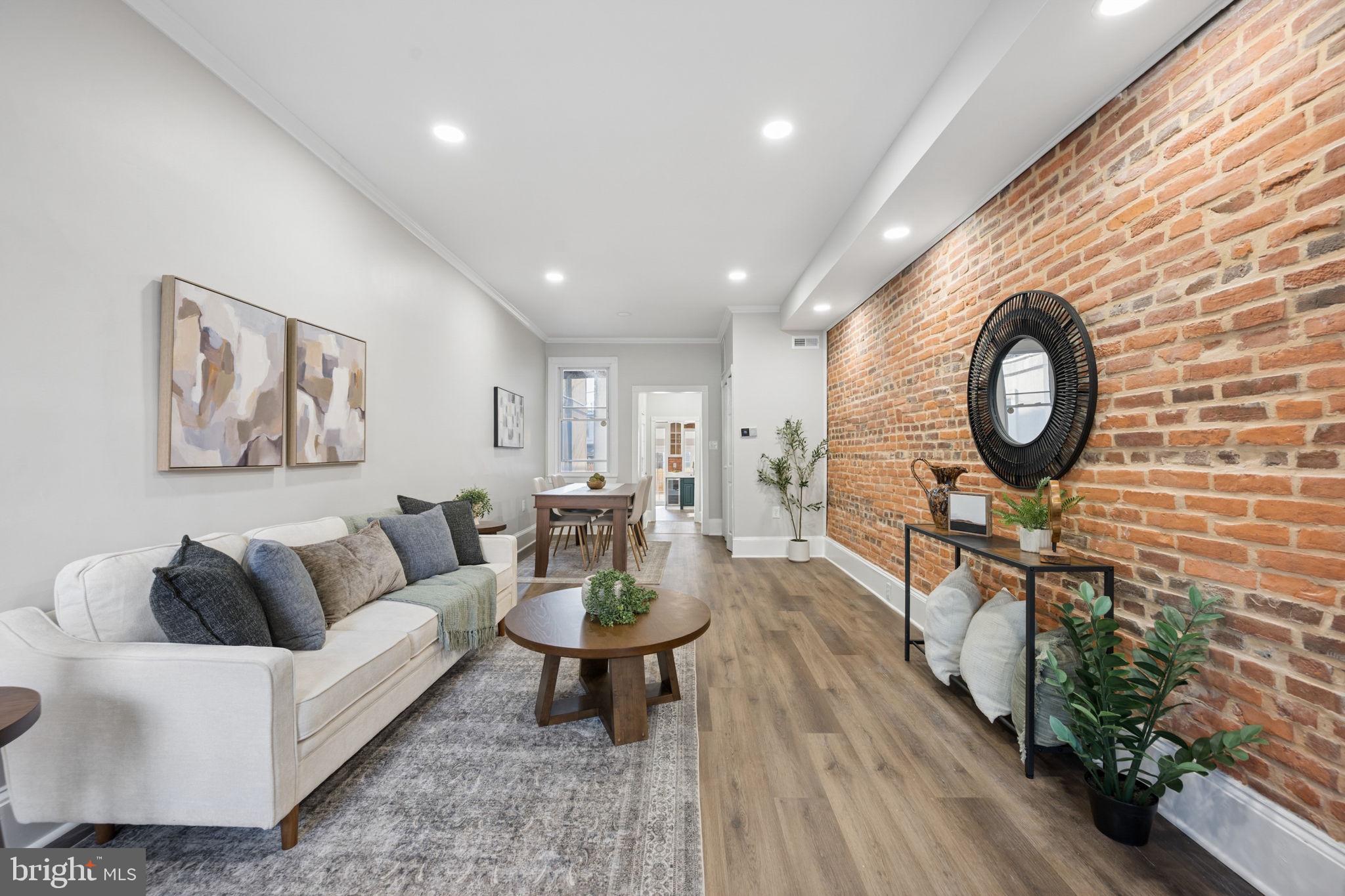 1108 South Clinton Street Baltimore, MD 21224 - Photo 7 of 66 Charming space with exposed brick warmth.