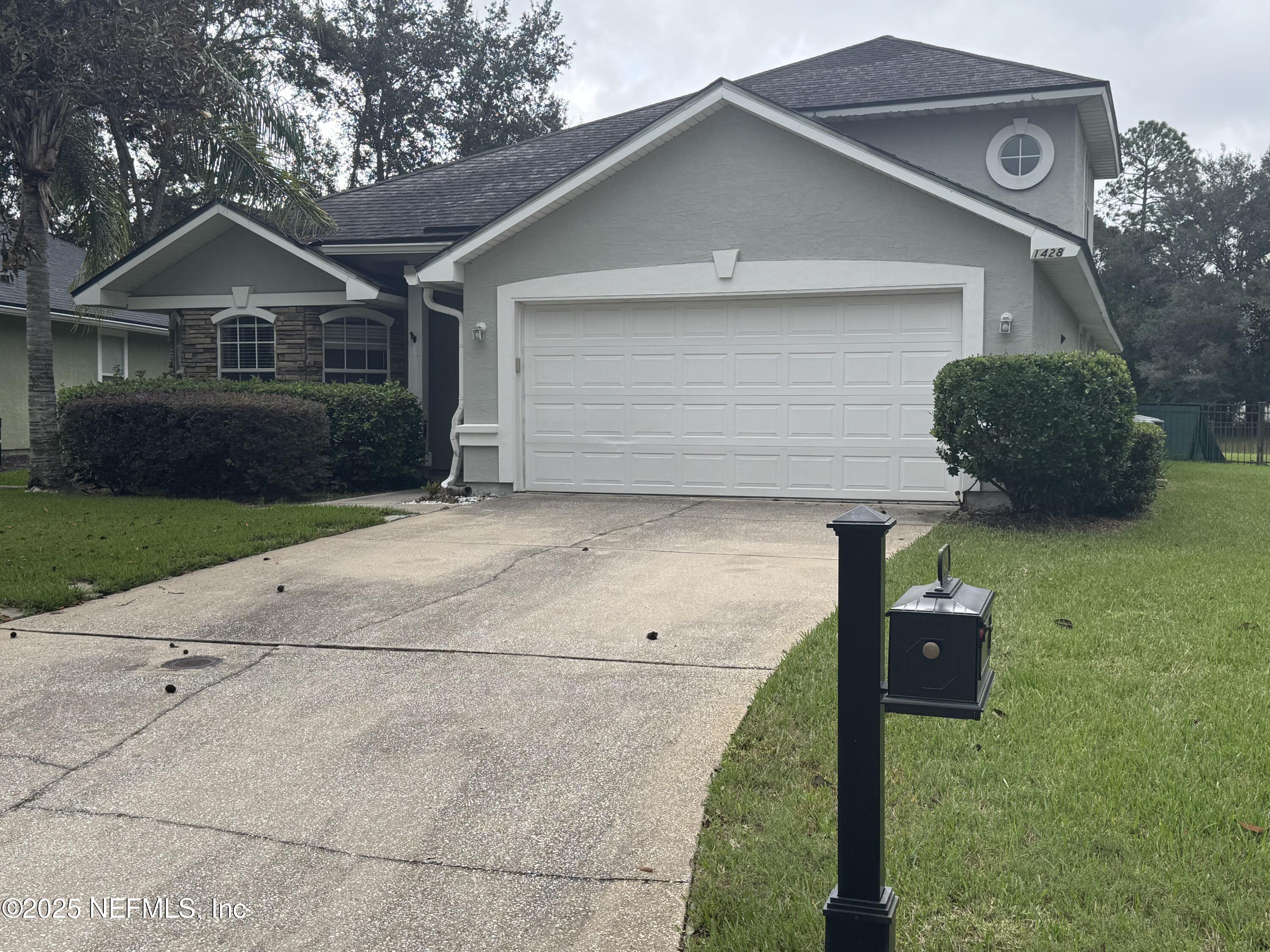 1428 Tintern Lane St. Augustine, FL 32092 - Photo 2 of 15 a front view of a house with a yard