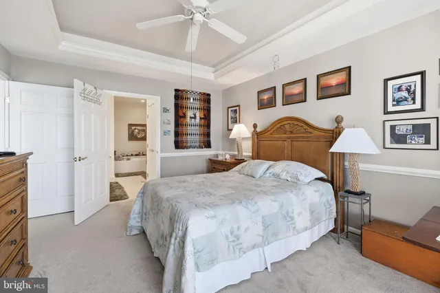 a bedroom with a bed and a table