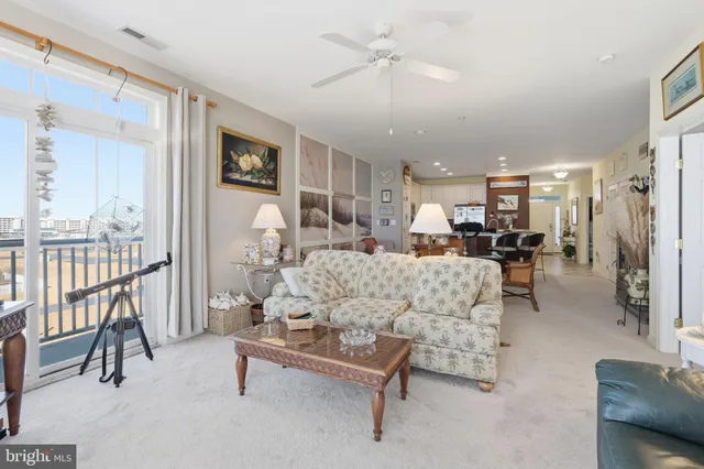 a kitchen with stainless steel appliances granite countertop a stove a sink a microwave a dining table and chairs