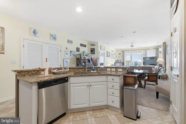 a kitchen with sink cabinets and window