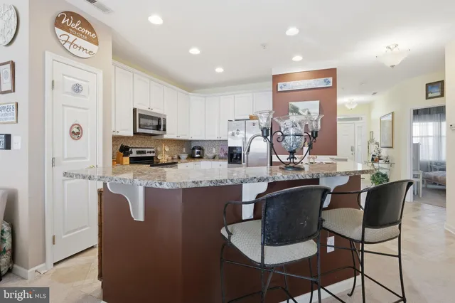a bathroom with a toilet sink and a mirror