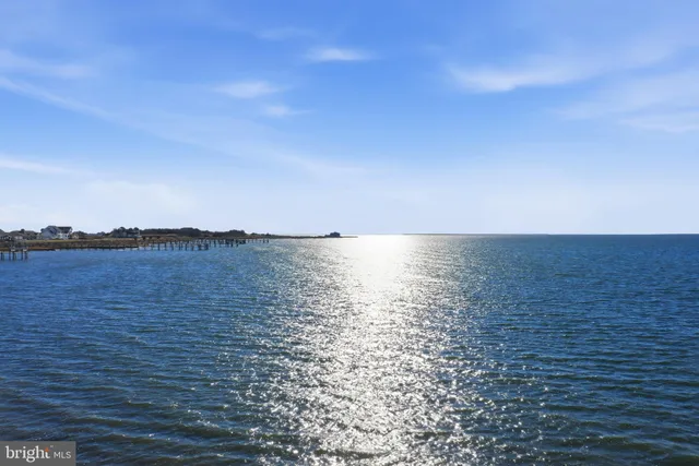 an aerial view of residential building with ocean view