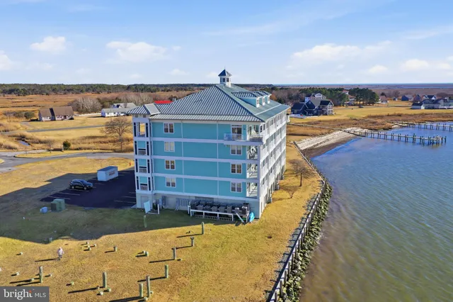 a view of a lake with houses in the back