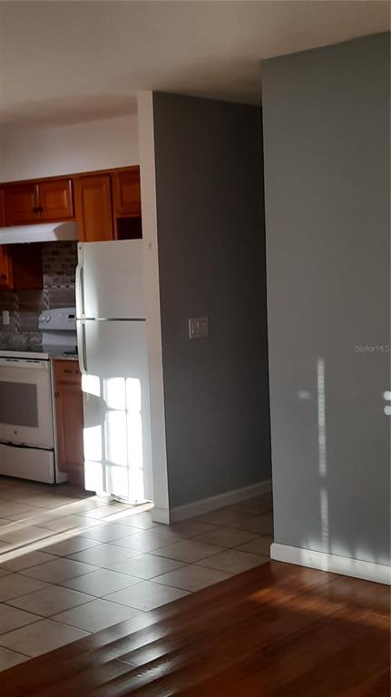 1333 Bender Avenue Holly Hill, FL 32117 - Photo 18 of 37 a view of empty room with wooden floor and fireplace