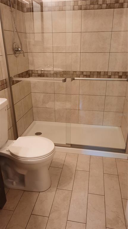 1333 Bender Avenue Holly Hill, FL 32117 - Photo 31 of 37 a bathroom with a toilet and a shower