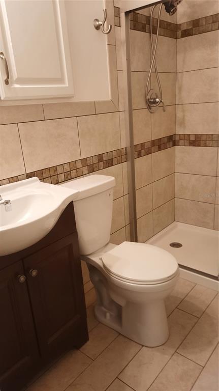 1333 Bender Avenue Holly Hill, FL 32117 - Photo 32 of 37 a bathroom with a toilet a sink and a shower