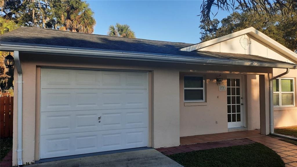 1333 Bender Avenue Holly Hill, FL 32117 - Photo 7 of 37 a view of a house with a door