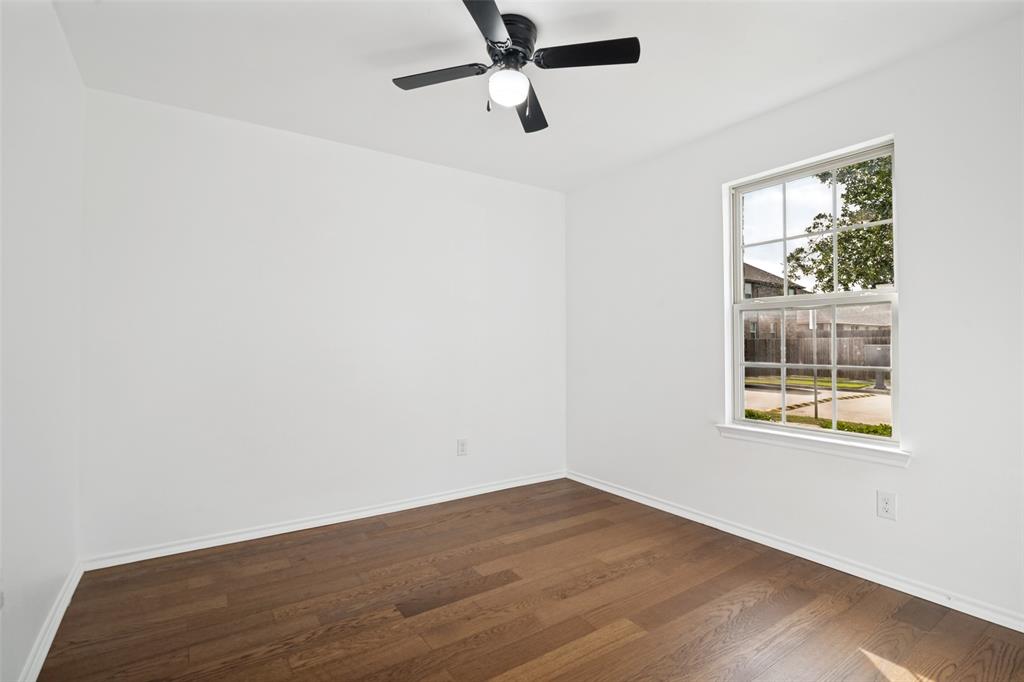 3415 Emerson Road Forney, TX 75126 - Photo 14 of 26 an empty room with a window and a ceiling fan