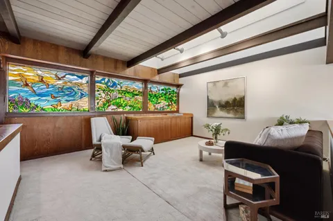 a bedroom with a large bed and a balcony view