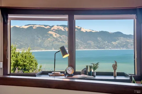 a view of a balcony with an ocean view