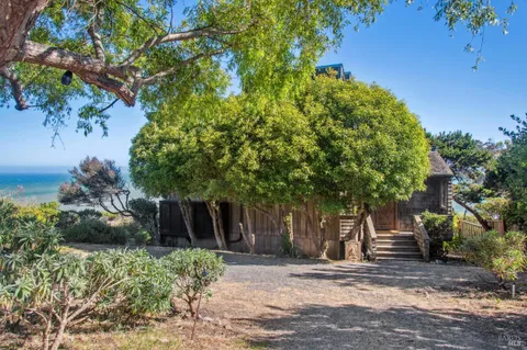 a bathroom with a sink a mirror and shower