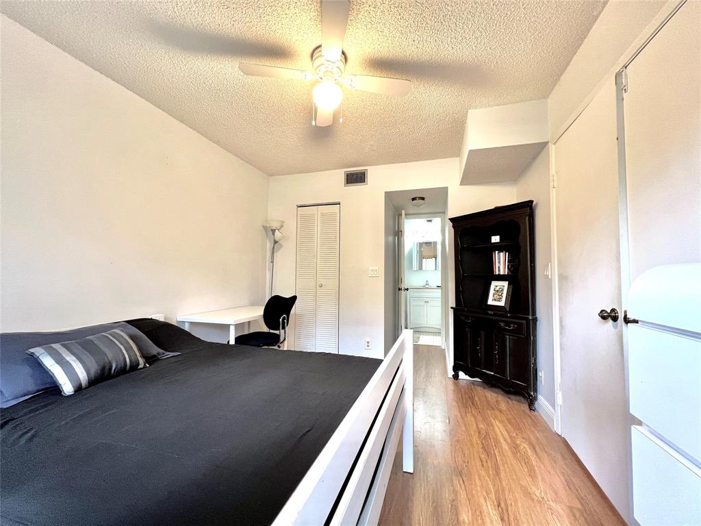7750 Northwest 79th Avenue, Unit H5 Tamarac, FL 33321 - Photo 12 of 28 a living room with furniture and a wooden floor