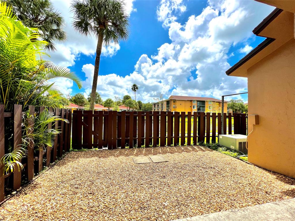 7750 Northwest 79th Avenue, Unit H5 Tamarac, FL 33321 - Photo 22 of 28 a view of a backyard