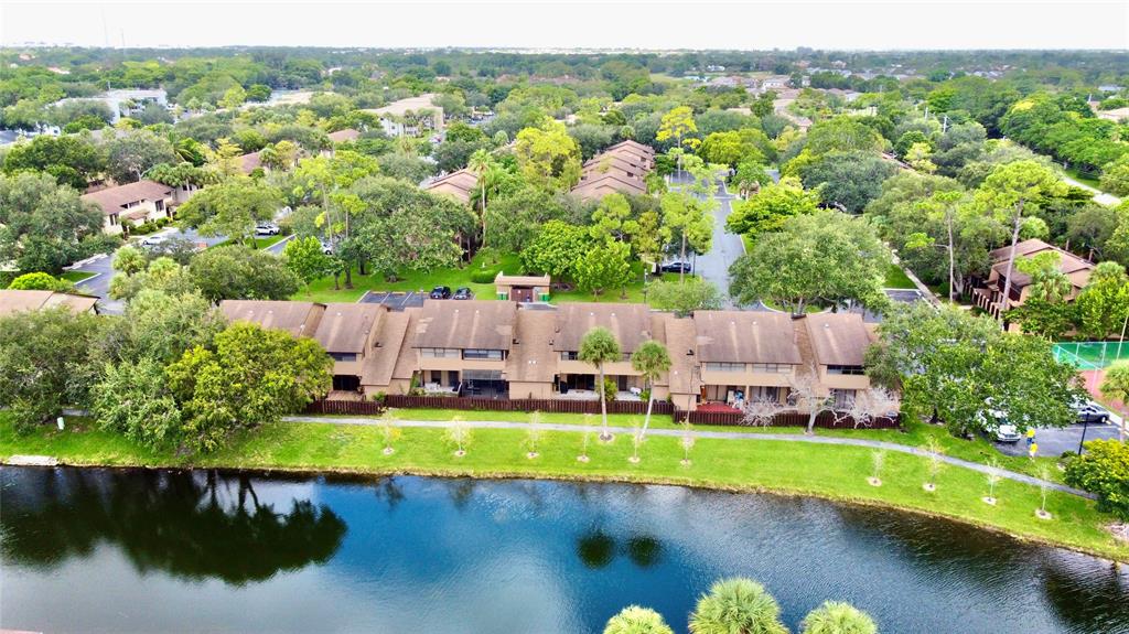 7750 Northwest 79th Avenue, Unit H5 Tamarac, FL 33321 - Photo 24 of 28 an aerial view of a house with a garden and lake view
