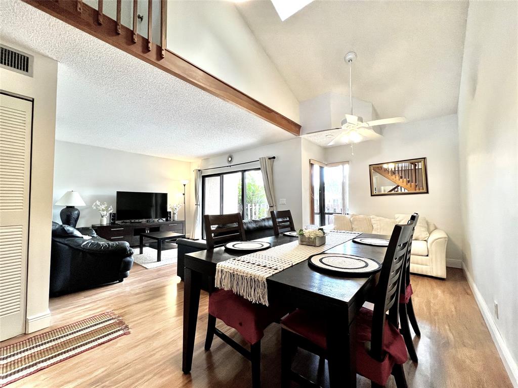7750 Northwest 79th Avenue, Unit H5 Tamarac, FL 33321 - Photo 7 of 28 a view of a dining room with furniture and wooden floor