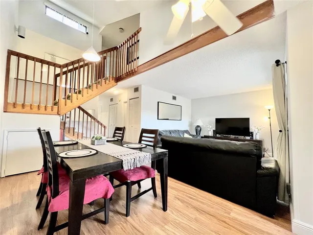 a dinning table and chairs in a room