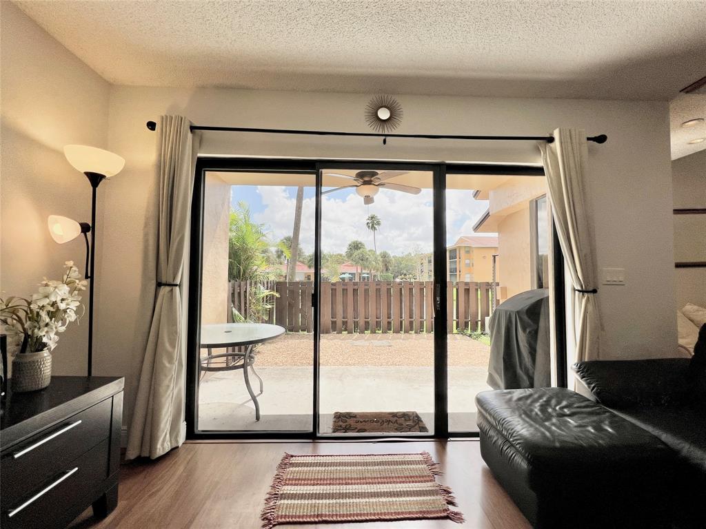 7750 Northwest 79th Avenue, Unit H5 Tamarac, FL 33321 - Photo 9 of 28 a view of a living room and a balcony